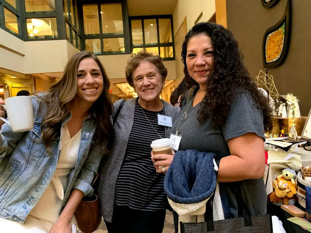 Three women posing for a photo